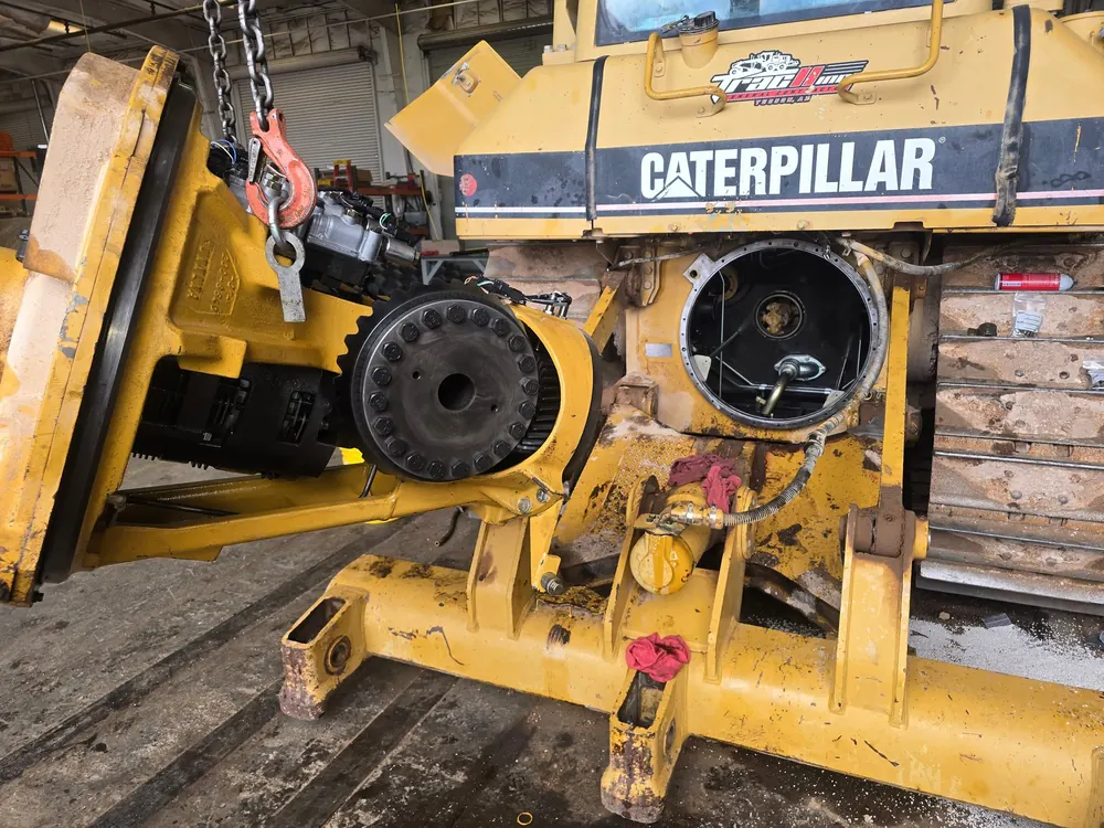Caterpillar dozer drivetrain component removed for repair